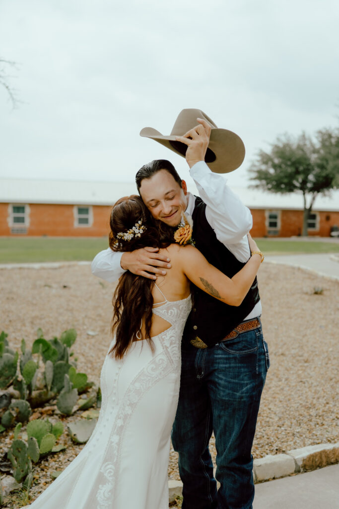 bride and groom hug during first look