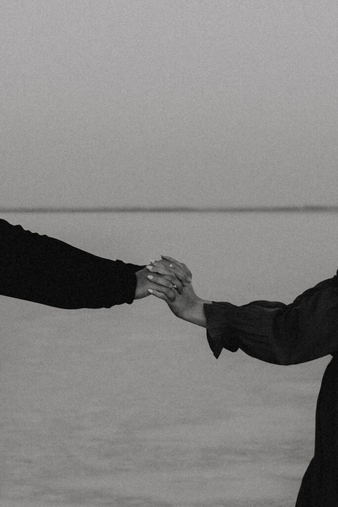 close-up of couples hands during their documentary style engagement session