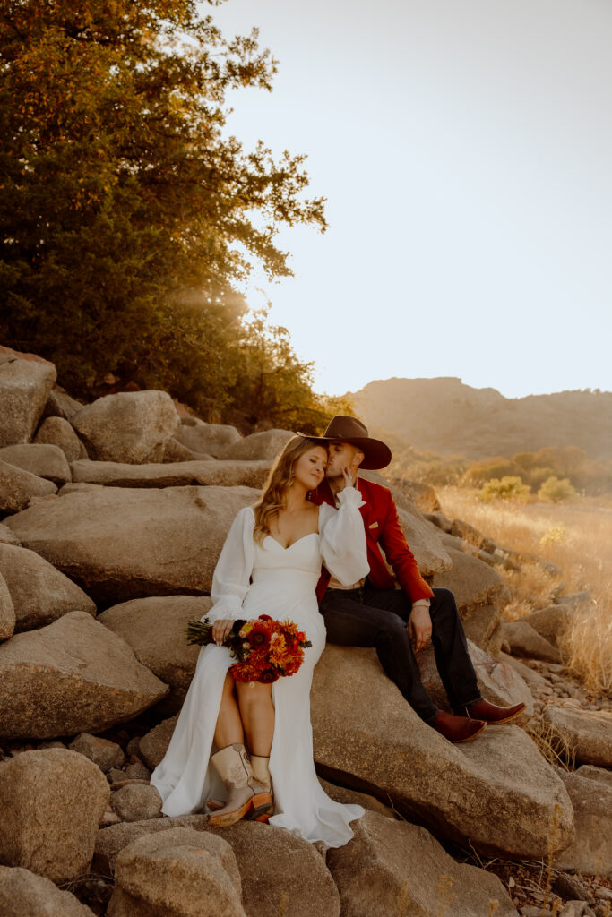 couple sitting on rocks during their oklahoma elopement
