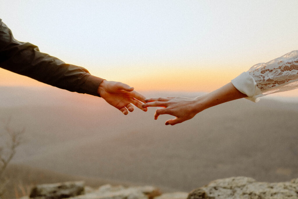 close up photo of bride and grooms hands
