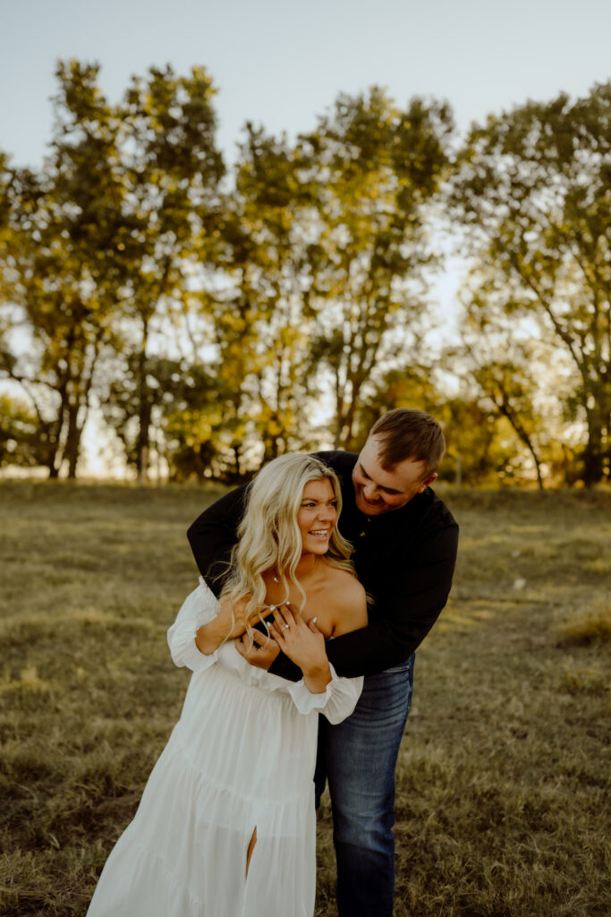 Sunset engagement portrait of a bride and groom on a ranch in Oklahoma