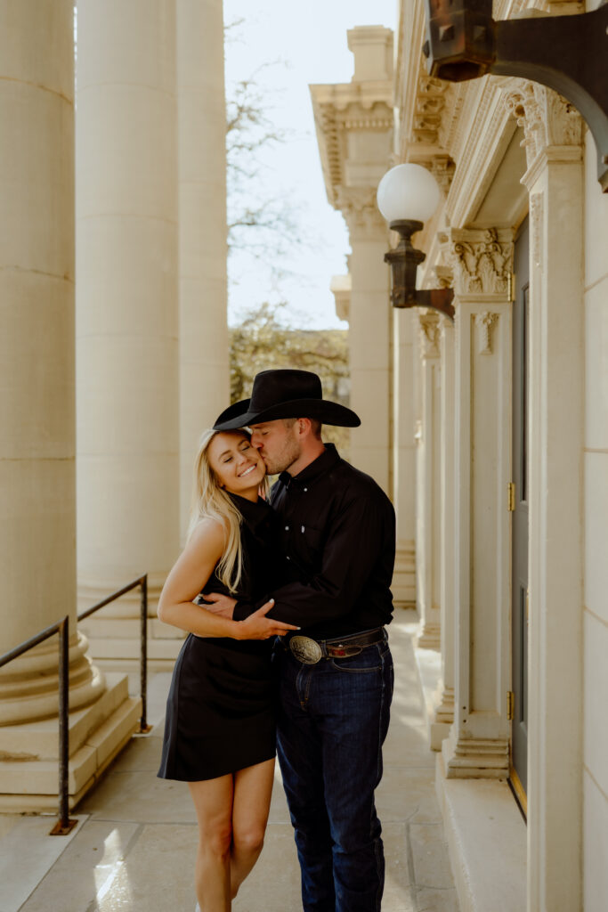 he kisses her on the cheek as they walk downtown