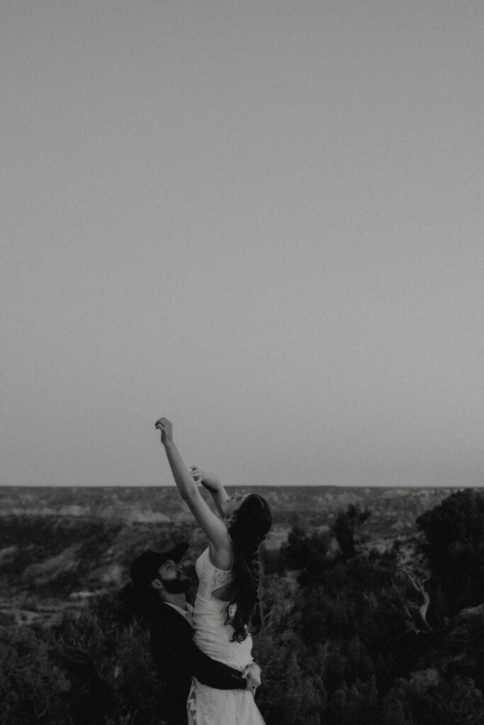 bride and groom portrait at dusk in palo duro canyon state park