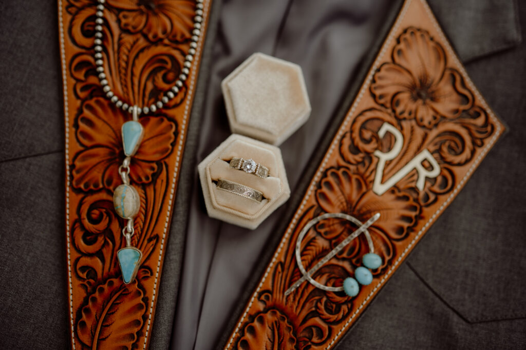 cowboy wedding rings and tooled leather jacket
