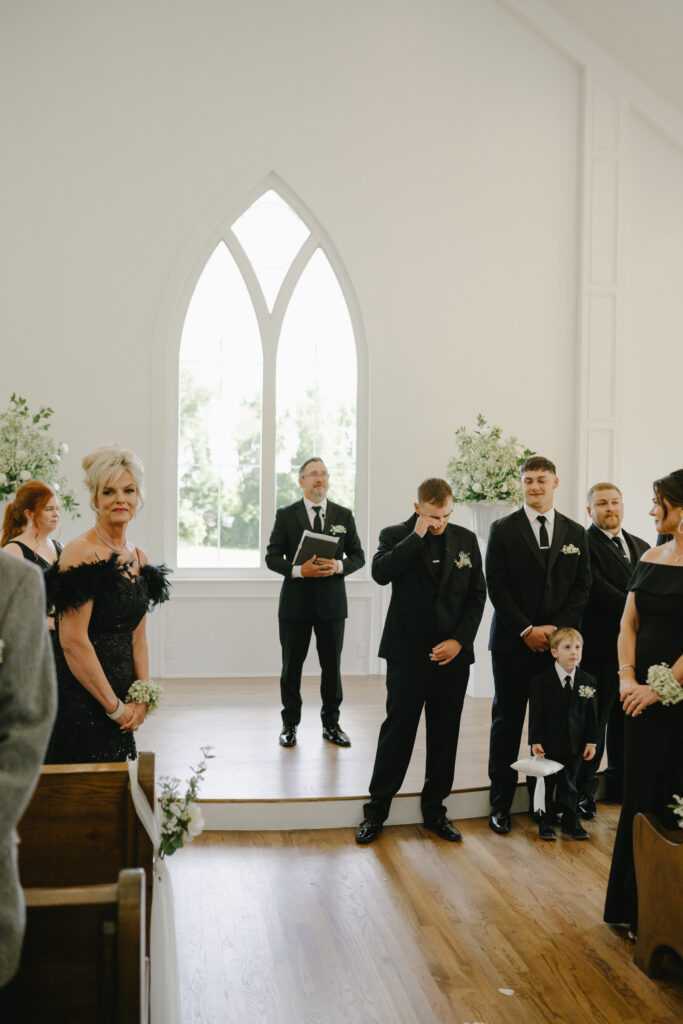 groom crying as he sees his bride at the chapel at the springs venue