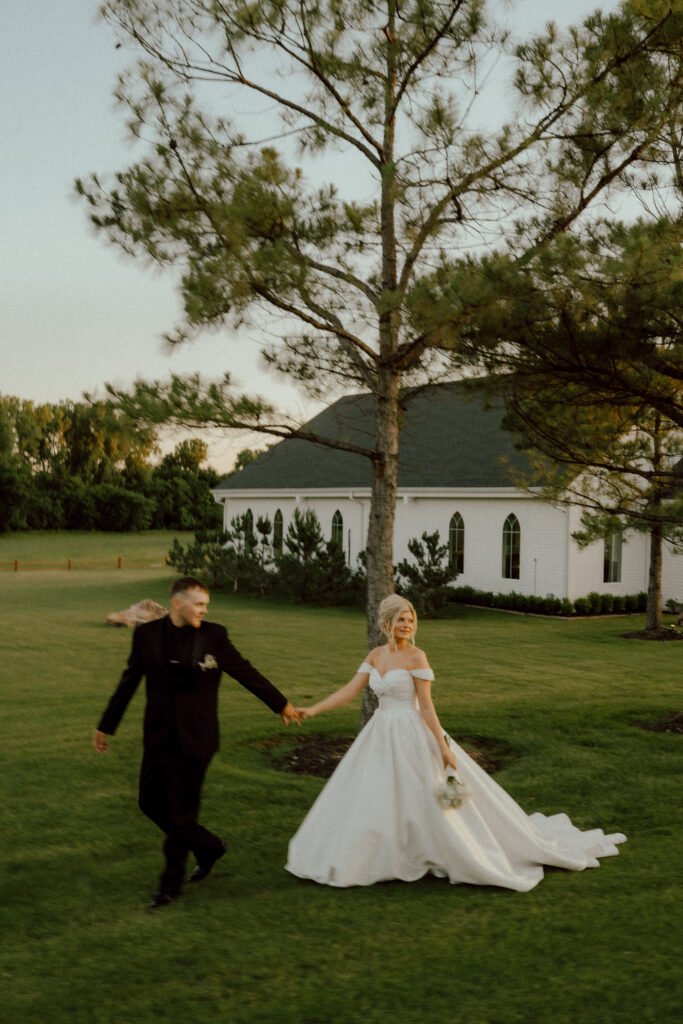 bride and groom walking hand in hand