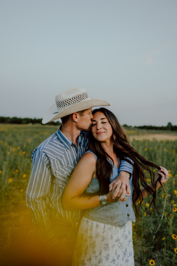 western couples session with sunflowers
