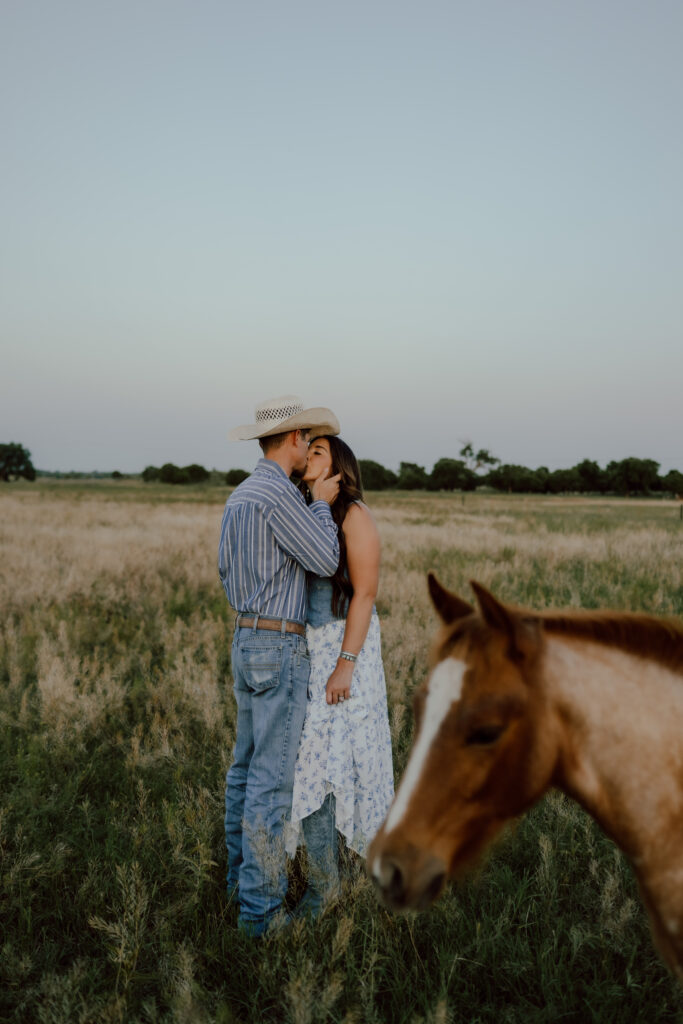 cowboy couple kissing