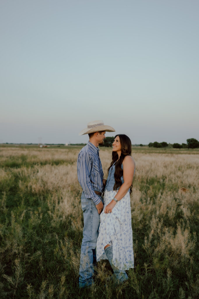 western couples photo in a field