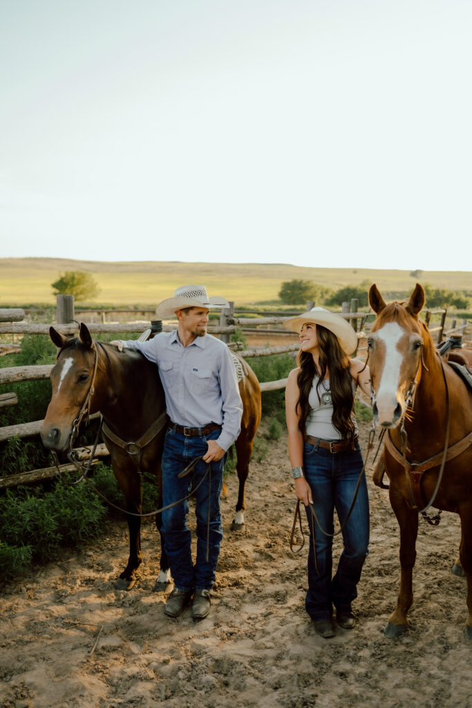 western couples photo with horses