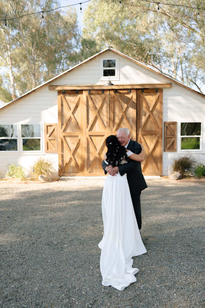 western elegance wedding bride and dad hugging