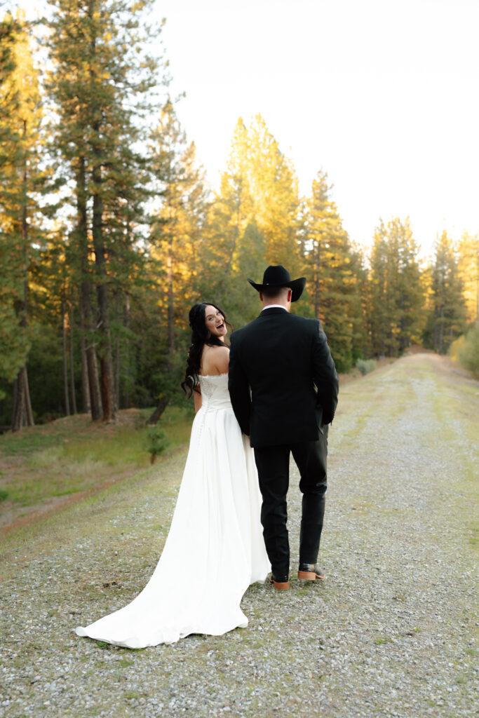bride looking back at western elegance wedding photographer