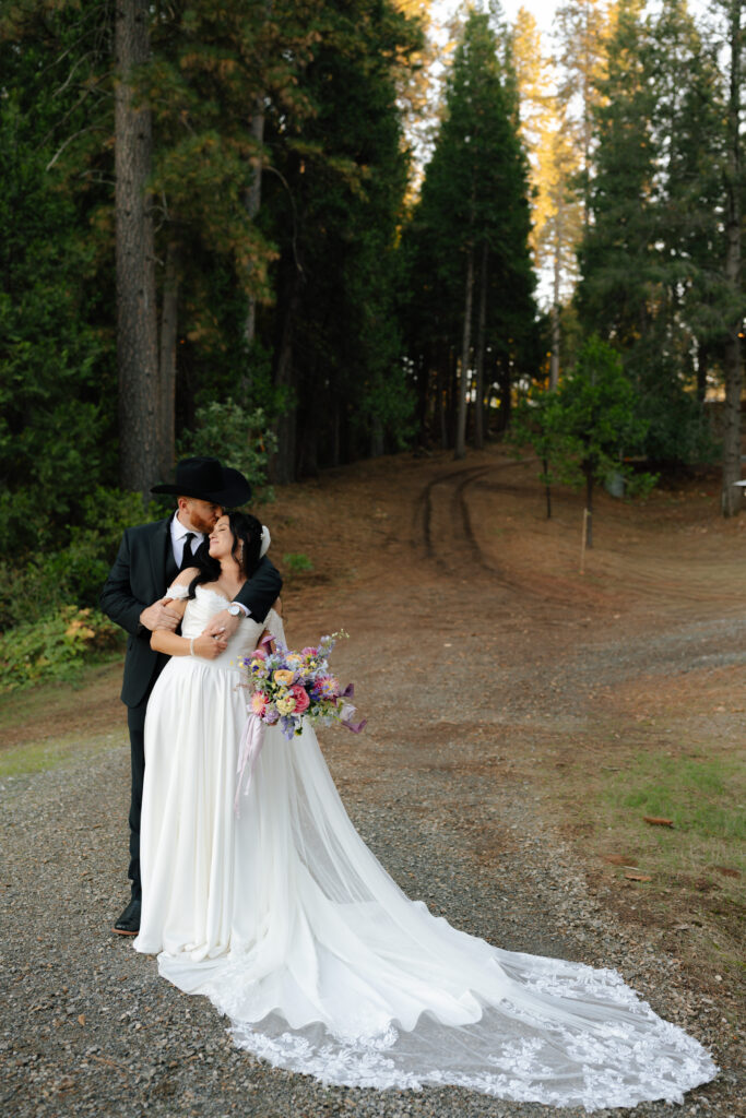 groom kissing bride on forehead