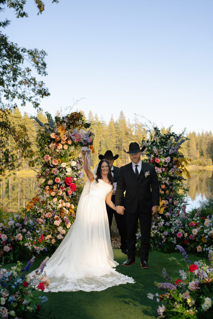 bride and groom cheering wedding ceremony