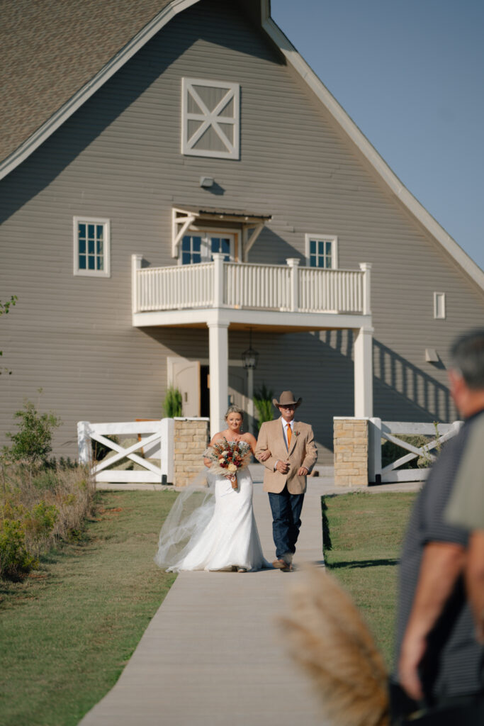 dad and bride walking aisle at Mcgranahan Barn wedding