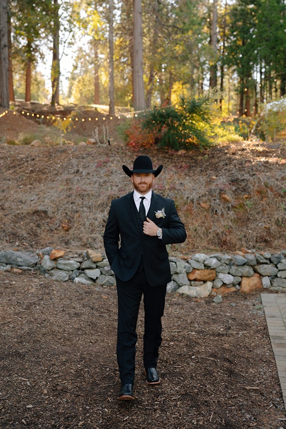 groom in suit at western wedding