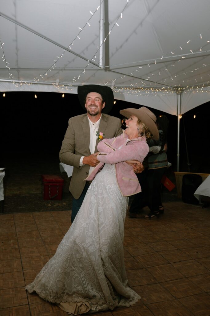 bride and groom dancing at western wedding reception