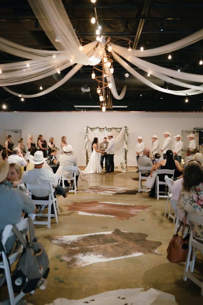 cowhide aisle at western wedding